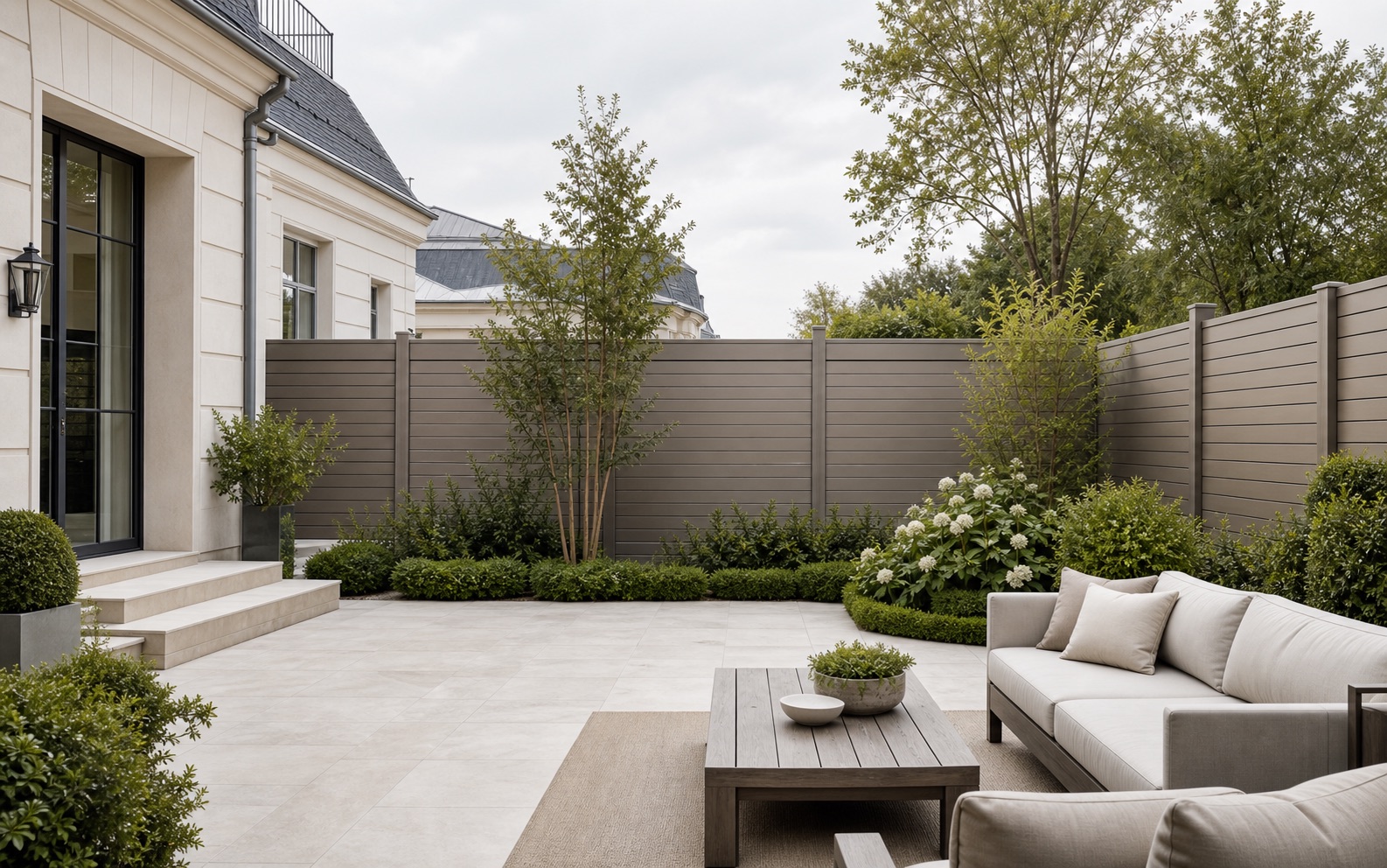Solid and hollow BPC privacy fence in a modern residential courtyard